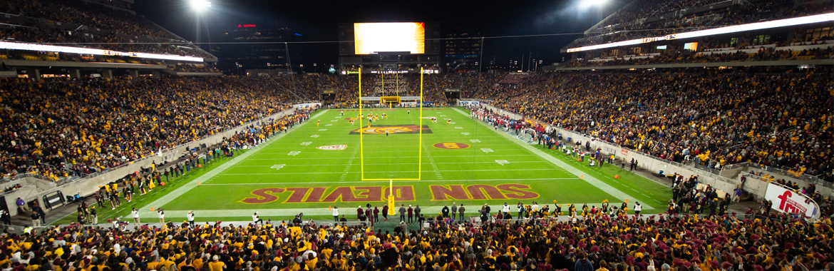 Fans and players at Sun Devil Stadium