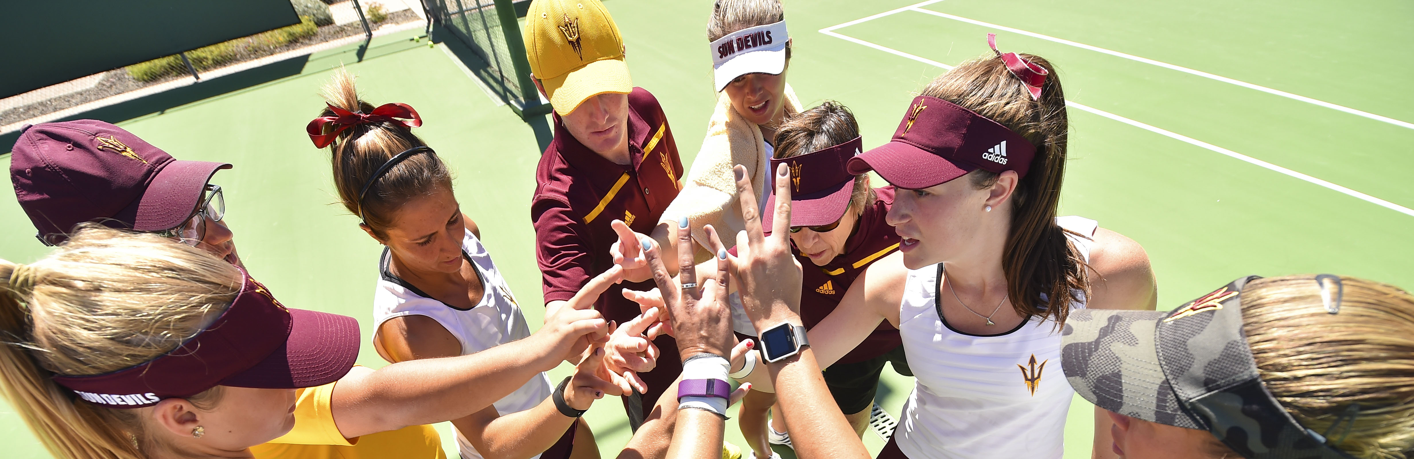 Womens Tennis players in a huddle